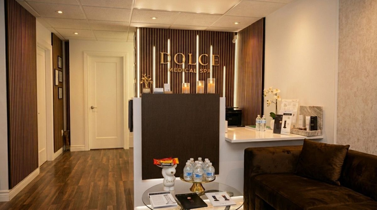 Dolce Medical Spa Miami reception with backlit DOLCE wood-slat wall