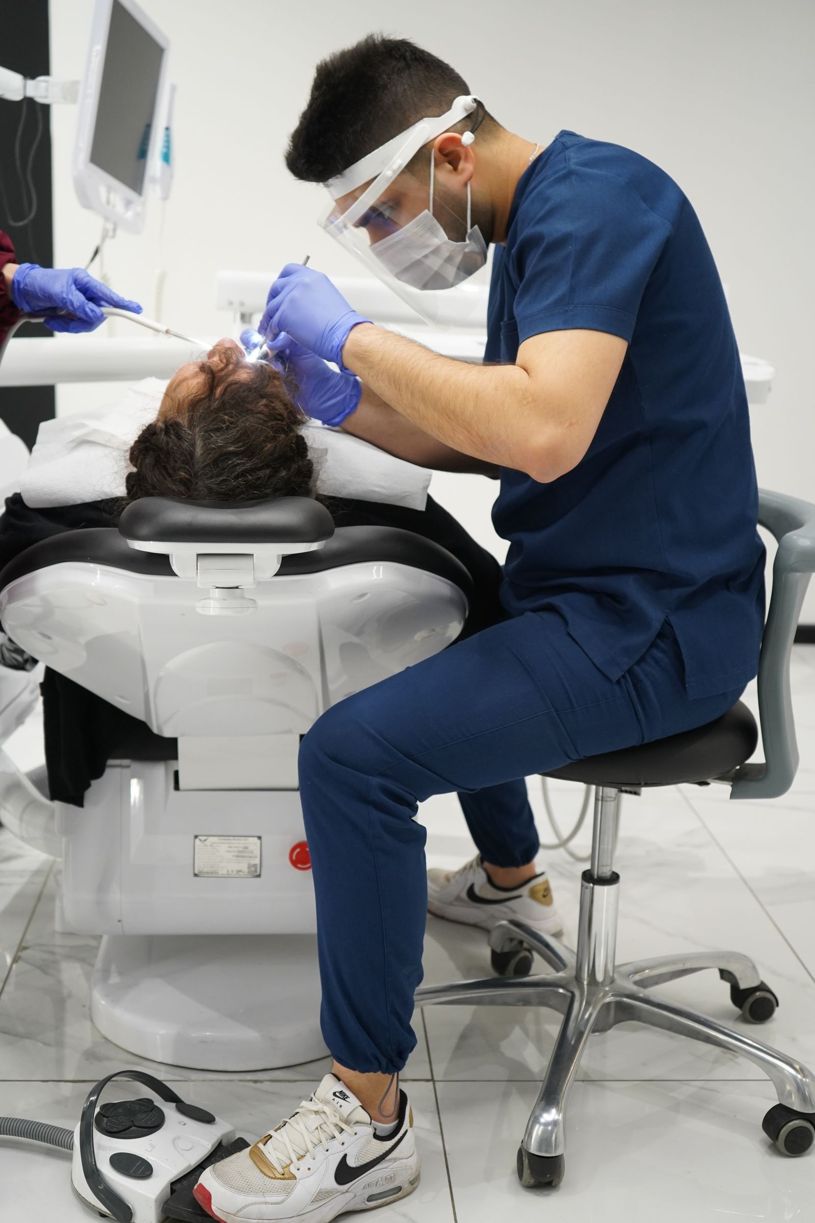 A dentist treating a patient