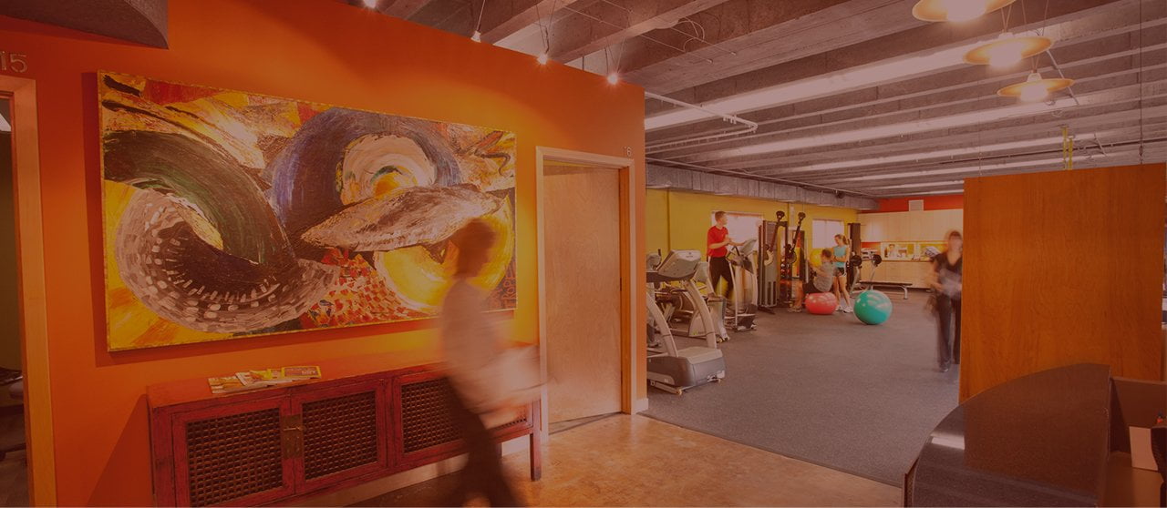 Inside the West Portland Physical Therapy Clinic — patients training in the open gym