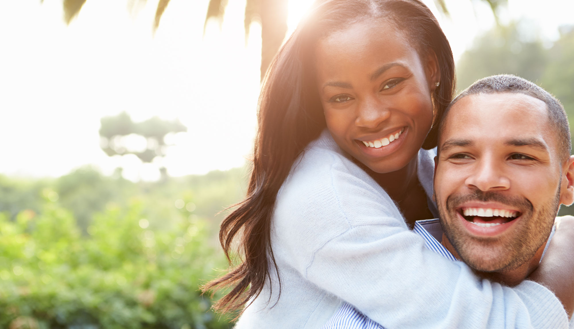 A couple sharing a warm, healthy smile together